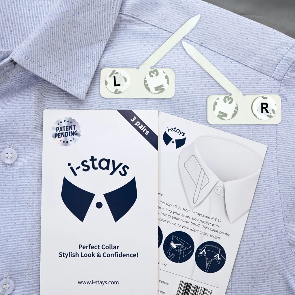 Photo of a shirt collar with two i-stays collar supports labeled L and R, accompanied by product packaging and instruction leaflet.